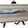 An extraordinary photo of the famed Bonneville salt flats by Joe Schmidt, framed with double mat and metal frame.